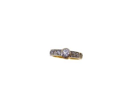 A diamond set ring, rubover set old brilliant cut diamond, estimated approximate weight 0.45ct, shoulders set with ten brilli