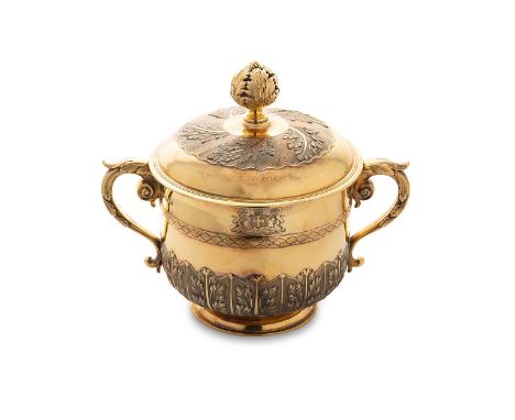 A George V silver gilt two handled porringer and cover, mark of Garrard &amp; Company, (Sebastian Henry Garrard), London 1932