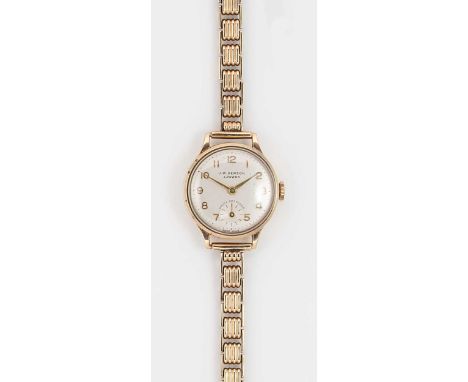 Cyma for J.W. Benson, London - A 9ct gold wristwatch, circa 1960, circular silvered dial with gold coloured Arabic numerals, 