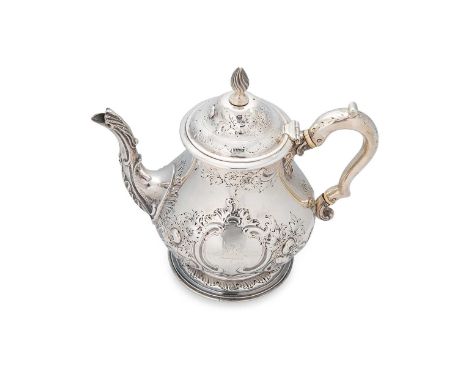 A Victorian silver teapot, mark of John Samuel Hunt, London 1858, of baluster form, the side with repoussé foliate decoration