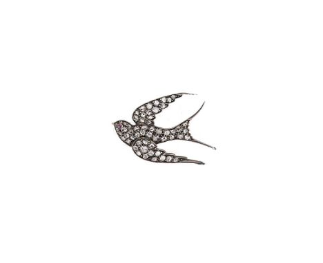 A Victorian diamond set swallow brooch,  set throughout with rose cut diamonds and a cabochon ruby for the eye, estimated app