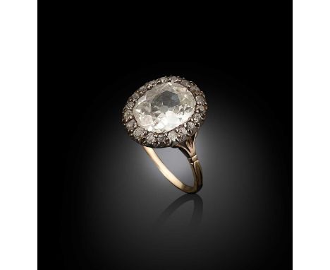 A late Victorian diamond cluster ring, oval shaped old brilliant cut diamond, approximately 11.95 x 9.55 x 4mm, estimated app