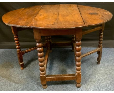 An 18th century oak gateleg dining or breakfast table, c.1740oval top with fall leaves, bobbin-turned supports and stretchers