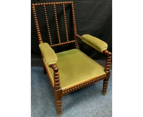 A 19th century rosewood bobbin turned side chair, stuffed over seat and arm rests, c.1840 