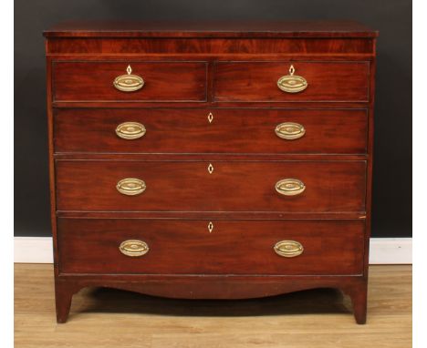 A George III mahogany chest, rectangular top above a flame veneered frieze outlined with boxwood and ebony stringing, two sho