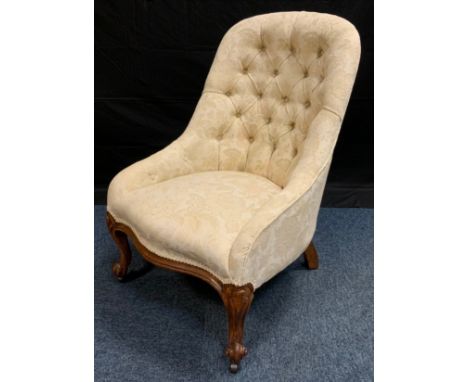 A Victorian nursing chairs, button back, scroll legs, c.1870 