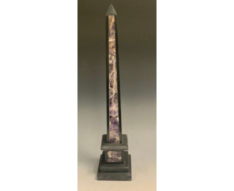 An amethyst quartz and black marble library obelisk, stepped bases, 40cm high 