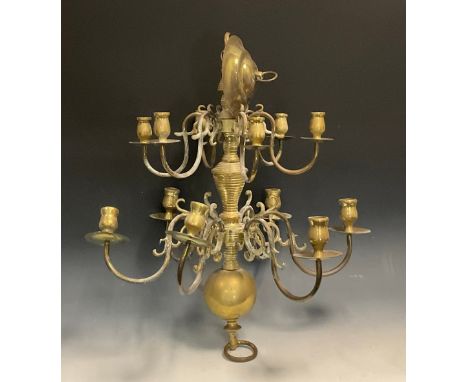 A 20th twelve light two tier brass ceiling chandelier, candle sconces, scroll arms, 66cm high 