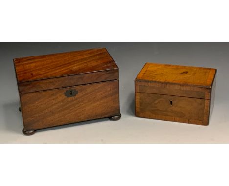 A 19th century mahogany tea caddy, quite plain, the interior with two lidded compartments, bun feet, 14cm high, 23cm wide, c.