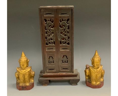 A Chinese family shrine cabinet, pierced doors, scroll feet, the boards for the relatives of Sz-To-Way, 34cm high, 18cm wide,