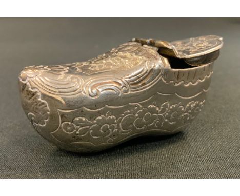 A silver coloured metal  novelty snuff box, as a clog  probably Dutch, engraved with foliate scrolls, 28mm high, 55mm long, 2