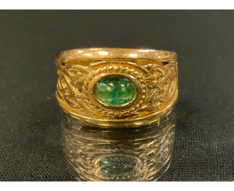 An emerald signet ring, open cast Celtic knot crest inset with a single oval cabochon emerald, 18ct gold shank, Birmingham 75