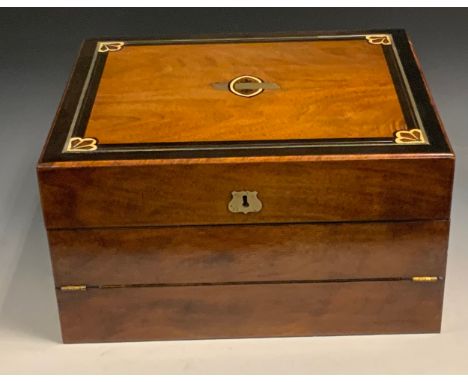 A Victorian mahogany folding writing desk, banded in ebony and outlined in brass, inkwell apertures, 18cm high, 33cm wide, 17