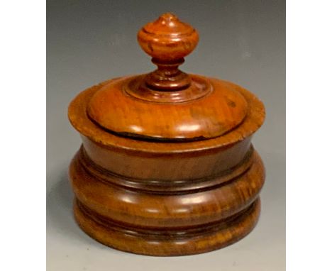 A 19th century turned mahogany tea caddy, bold finial, 19cm high, 15cm diam, c.180 