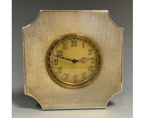 A silver easel travelling timepiece, engine turned, 10cm high, British Metallising Co Ltd, London 1875 