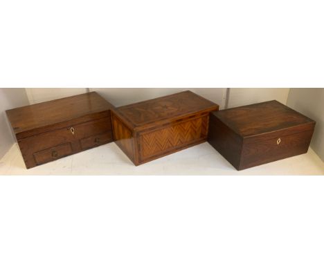 A 19th century parquetry box, the cover inlaid with star, the ground in herringbone bands, chequered banded border, 33cm wide