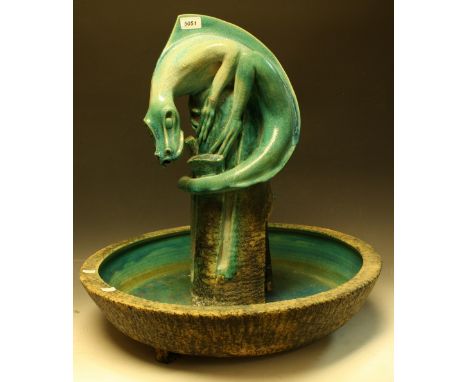A large ceramic dragon water feature, turquoise glaze, approx 58cm diameter, 64cm high overall