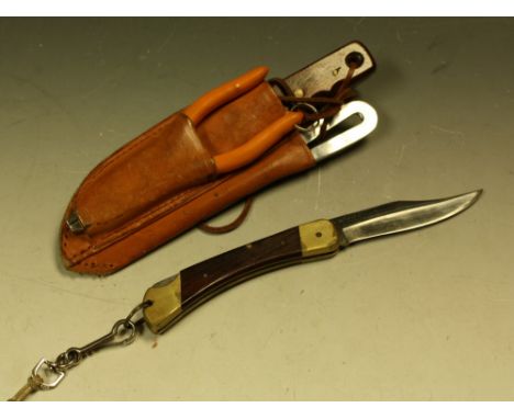 A vintage 1960's Puma Plainsman 970 folding pocket knife, 97mm blade, brass and wooden grip, serial No 96011, boxed with orig