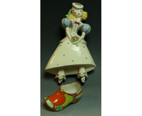 A Clarice Cliff Bizarre Fruitburst pattern sabot, 11cm wide, printed Newport factory mark; a Crown Devon French Girl wall pla