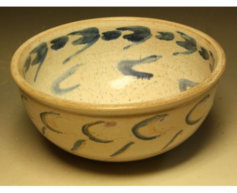 A large stoneware bowl, by David Leach, speckle glazed in shades of cobalt blue on an orange and white ground, the interior a