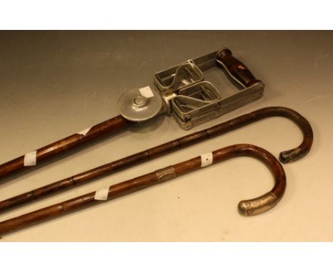 A silver topped gentleman's walking cane; another similar; a Presto shooting stick (3)