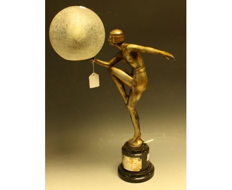 An Art Deco spelter table lamp, modelled as a scantily clad dancing girl in period dress, with bobbed hair and hoop earrings,