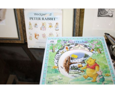 FOUR BOXED ROYAL DOULTON WINNIE THE POOH COLLECTORS PLATES TOGETHER WITH A WEDGWOOD EXAMPLE 