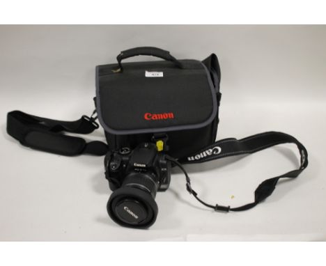 A CASED CANON EOS 400D DIGITAL CAMERA AND ACCESSORIES 