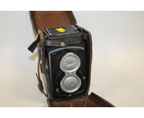 A LEATHER CASED VINTAGE ROLLEICORD COMPUR CAMERA 