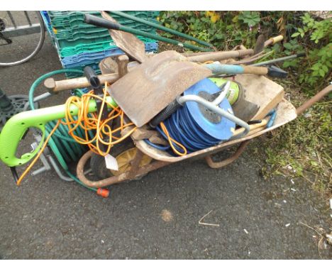 A VINTAGE WHEELBARROW CONTAINING ASSORTED TOOLS ETC
