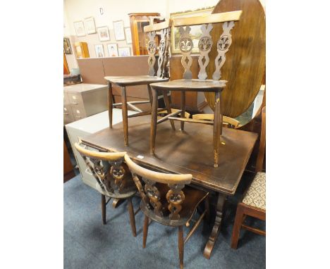 AN ERCOL STYLE OAK DRAWLEAF TABLE AND SIX CHAIRS