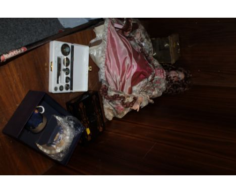 A BOXED ROYAL WORCESTER MILLENNIUM CUP AND SAUCER,  A CASED SET OF BRASS WEIGHTS, A STAIGER CARRIAGE / MANTEL CLOCK PLUS A LI