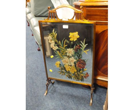 A BRASS MIRRORED FIRESCREEN WITH FLORAL PAINTED DETAIL