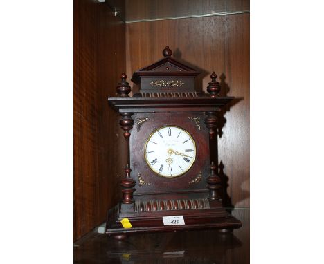 A REPRODUCTION MAHOGANY MANTLE CLOCK BY THOS BLAKEMORE 