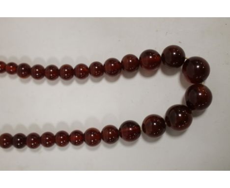 A VINTAGE CHERRY AMBER STYLE NECKLACE