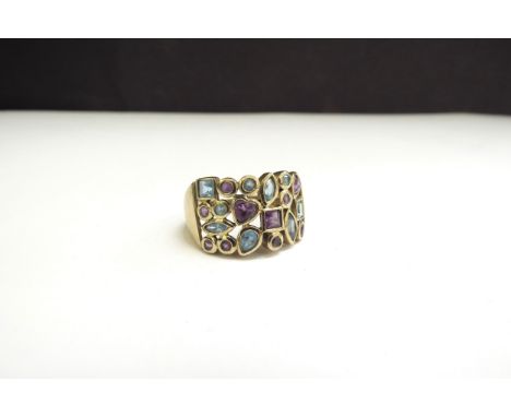 A 9ct gold amethyst and topaz ring. Size R, 5.4g 