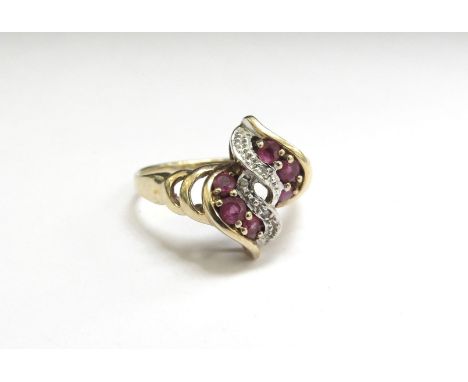 A 9ct gold ruby and diamond chip ring. Size Q, 3g 