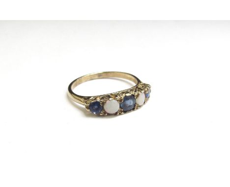 A 9ct gold five stone sapphire and opal ring. Size K, 1.6g 