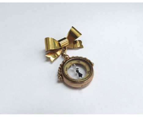 A 9ct gold cased compass on a 9ct gold bow brooch pin, 8.5g total 