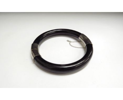A black jade bracelet, 6cm diameter 