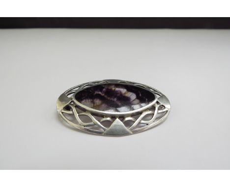 An oval silver brooch with central Blue John panel, 5cm x 3.3cm, 10.8g 