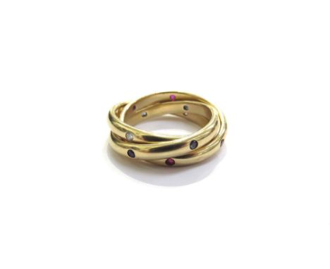 A Cartier gold trinity ring diamond, emerald and ruby set bands, marked Cartier 1995 750, 52 E72878 inside diamond band. Size