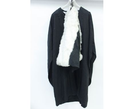 A Cambridge university cloak, with a fur collar and a photograph of the recipient
