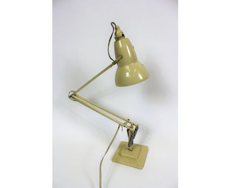 An Angle poise lamp with a two stepped base, in a cream colour