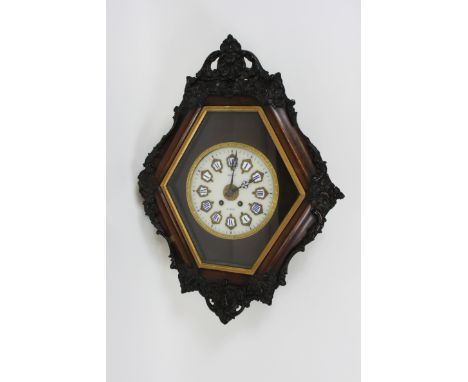 A late 19th century French wall clock, with a white ceramic face, enamel numerals with an eight day movement, stamped Rollin,