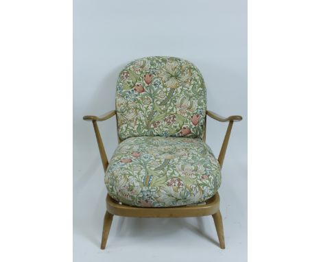An Ercol beech and elm armchair