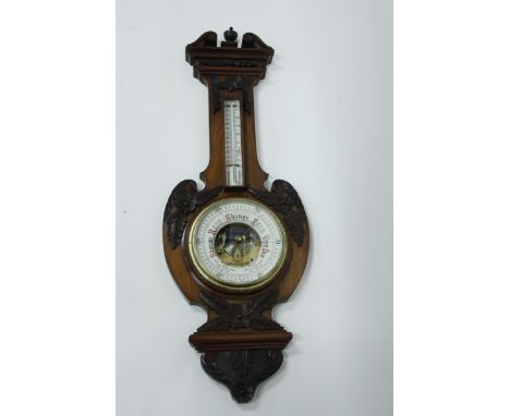 An early 20th century mahogany aneroid barometer