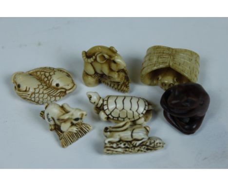 A collection of seven carvings/netsuke to include two rabbits, rat, turtle, frog, mouse, fish and a bat 