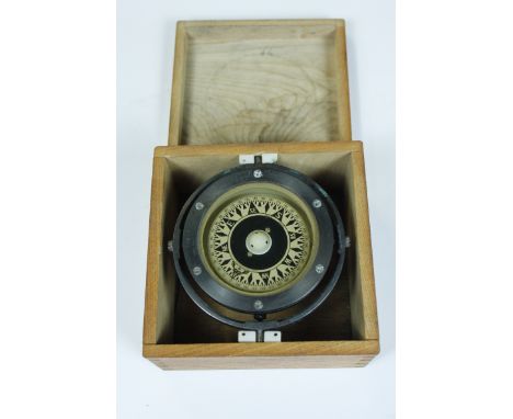 A ships compass by Saura Keiki Seisakusho Ltd, in a fitted oak case 