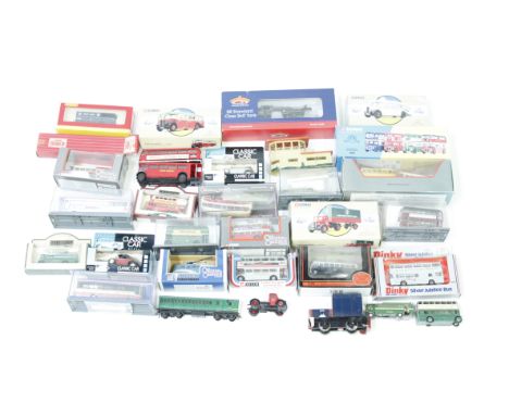 A collection of boxed model cars and other vehicles